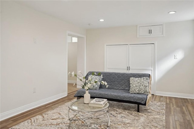 sitting room with hardwood / wood-style floors