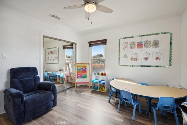 interior space featuring hardwood / wood-style flooring and ceiling fan