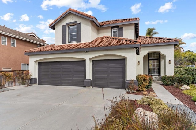 mediterranean / spanish-style house featuring a garage