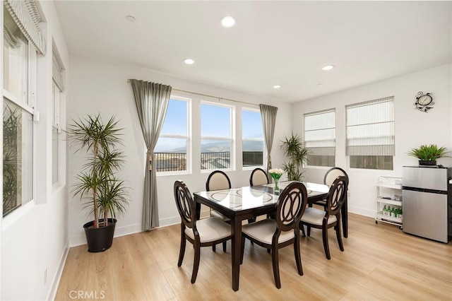 dining area with light wood-type flooring