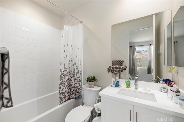 full bathroom featuring vanity, toilet, and shower / bath combo with shower curtain