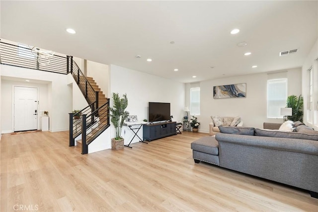 living room with light hardwood / wood-style flooring