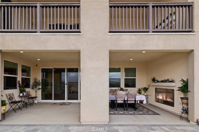 view of patio with a balcony