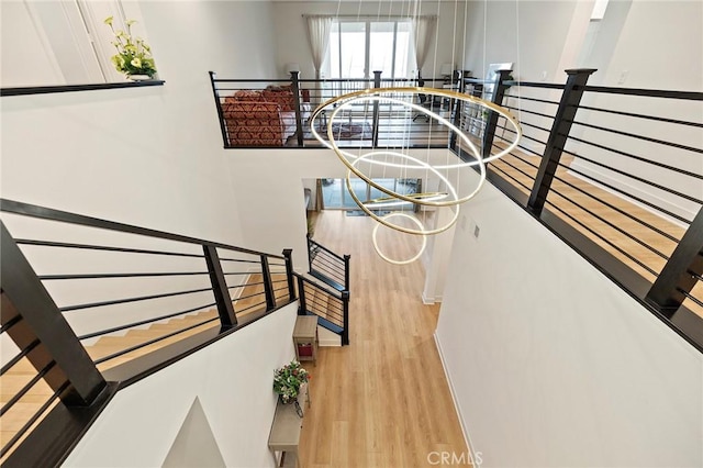 stairs featuring hardwood / wood-style floors