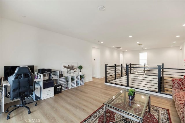 office space with light wood-type flooring