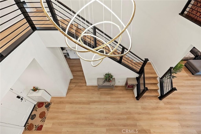 stairs with hardwood / wood-style floors