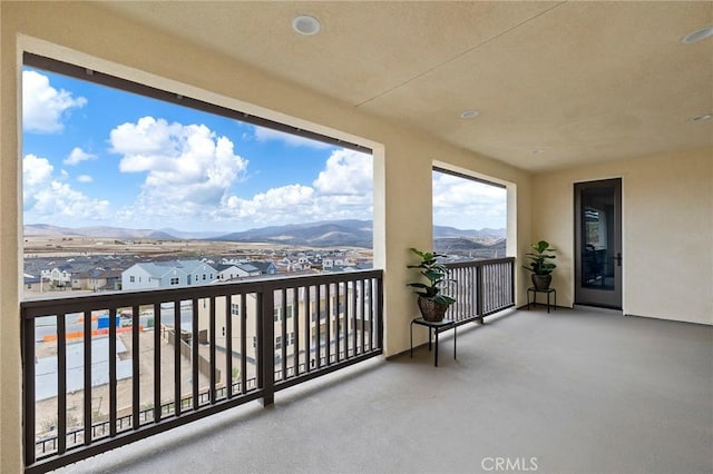 balcony featuring a mountain view