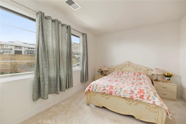 bedroom with light carpet