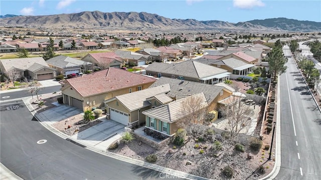 birds eye view of property featuring a mountain view