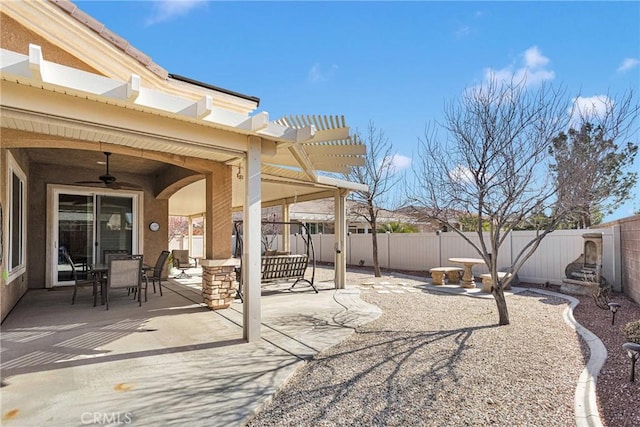 view of patio / terrace with a pergola and ceiling fan