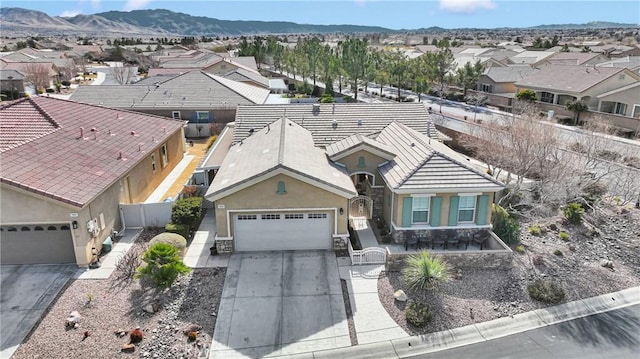 birds eye view of property with a mountain view