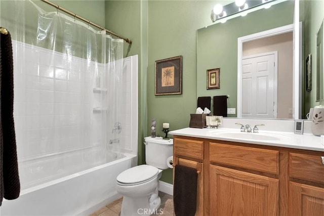 full bathroom featuring tile patterned flooring, vanity, toilet, and shower / bath combo with shower curtain