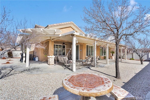 back of house featuring a patio and ceiling fan