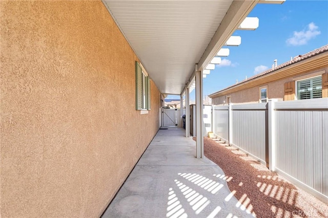 view of side of home with a patio