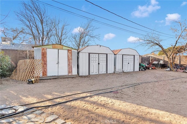 view of shed with fence