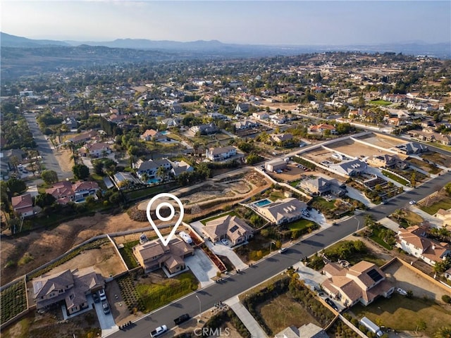 birds eye view of property with a mountain view