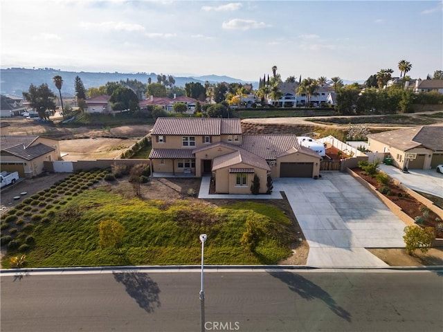 birds eye view of property featuring a mountain view