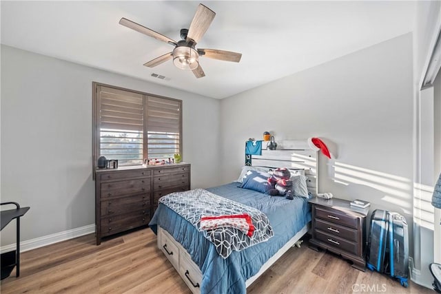 bedroom featuring hardwood / wood-style floors and ceiling fan