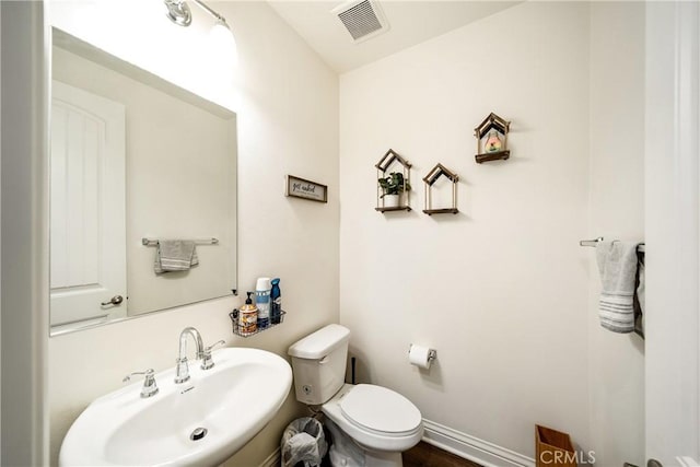 bathroom with sink and toilet