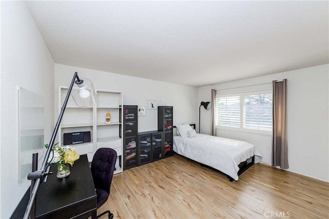 bedroom featuring hardwood / wood-style floors