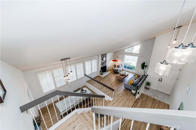 living room with hardwood / wood-style flooring and vaulted ceiling