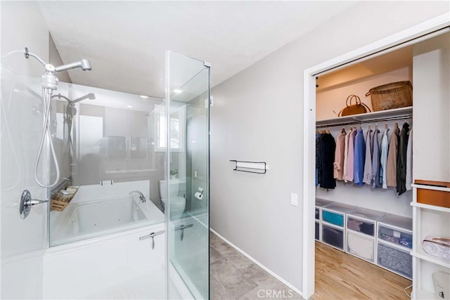 bathroom featuring independent shower and bath and hardwood / wood-style flooring