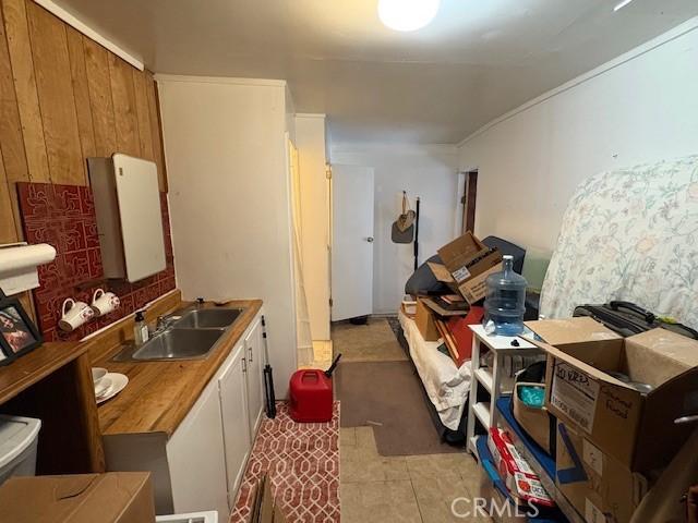 interior space with sink and light tile patterned floors