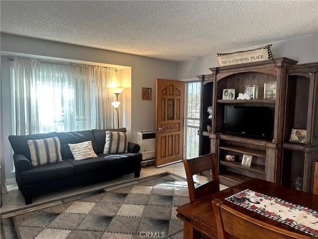 living room featuring heating unit, tile patterned flooring, and a textured ceiling