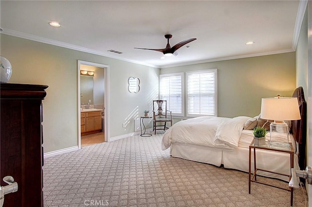 bedroom with connected bathroom, sink, ornamental molding, light colored carpet, and ceiling fan