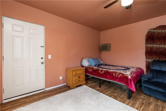 bedroom with hardwood / wood-style floors and ceiling fan