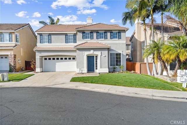 view of front of house with a garage and a front yard