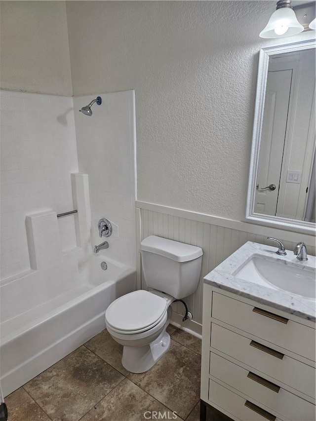 full bathroom featuring vanity, toilet, and  shower combination