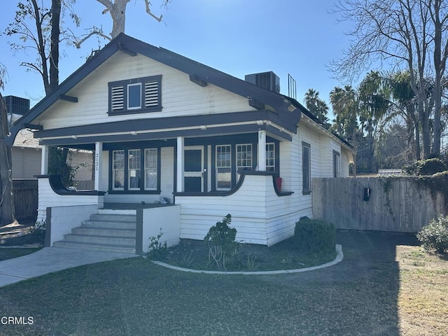 bungalow-style home with central AC unit and covered porch