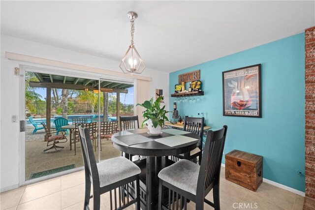 dining space with light tile patterned floors