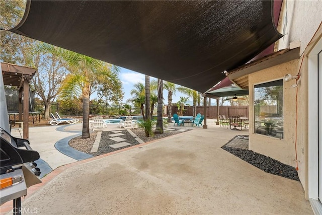 view of patio featuring a fenced in pool