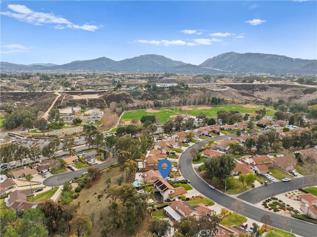 birds eye view of property with a mountain view