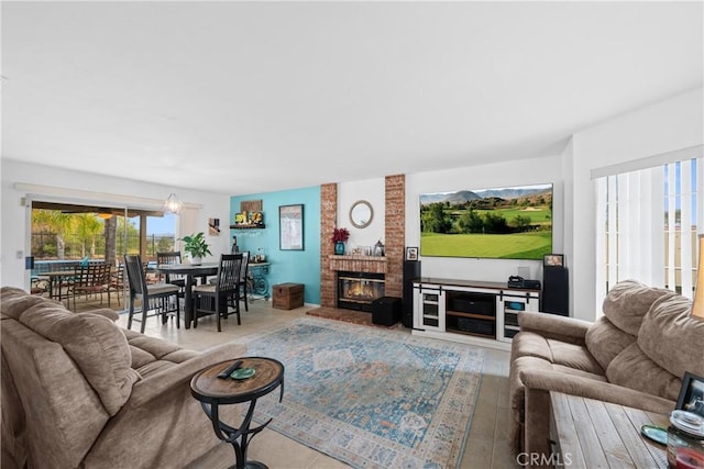 living room featuring a brick fireplace