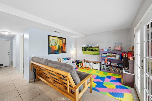 game room featuring light tile patterned floors