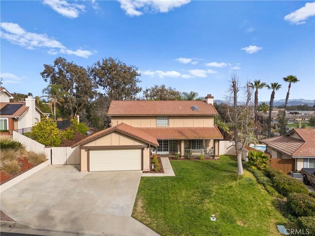 view of front of home with a garage and a front yard