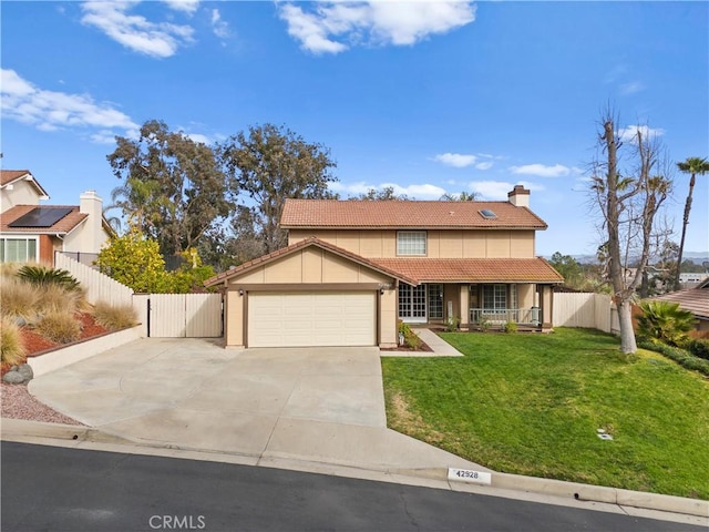 view of front of home with a garage and a front yard