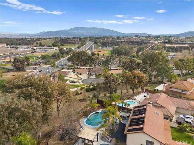 birds eye view of property with a mountain view