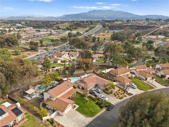 birds eye view of property featuring a mountain view