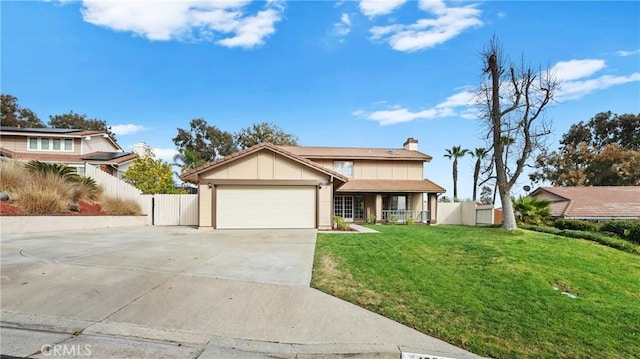 view of front of home with a garage and a front yard