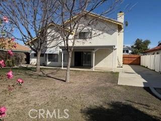 rear view of property featuring a patio area