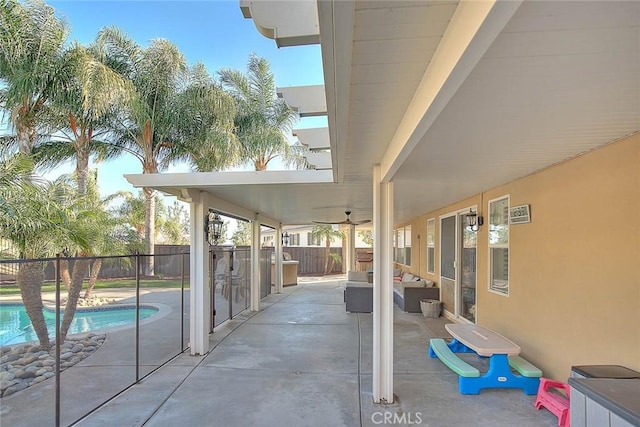 view of patio / terrace with a fenced in pool, an outdoor hangout area, and ceiling fan