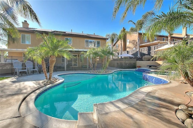 view of swimming pool featuring a patio area