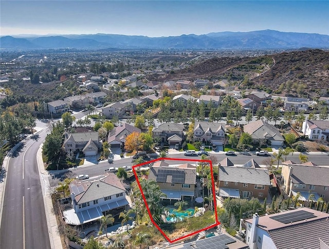 birds eye view of property featuring a mountain view