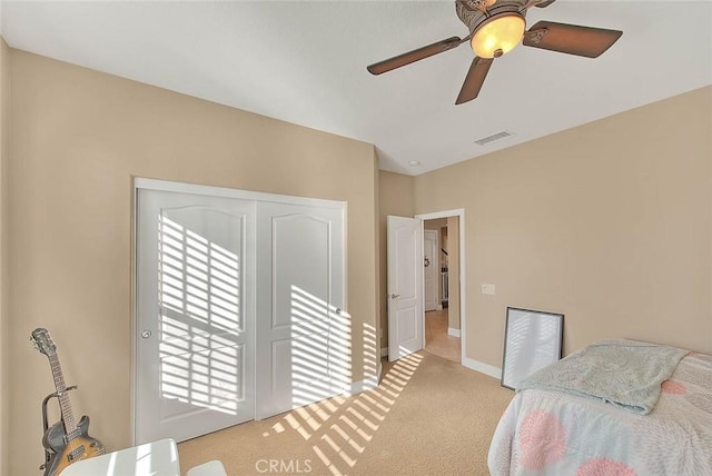 carpeted bedroom with ceiling fan