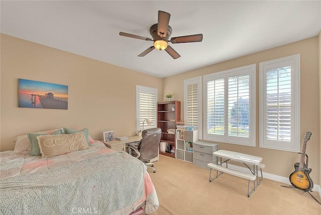 carpeted bedroom featuring ceiling fan