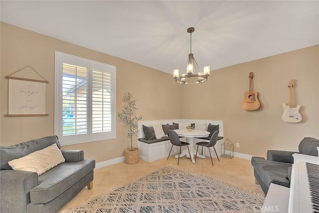 living room featuring light tile patterned flooring and an inviting chandelier